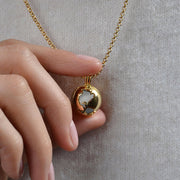 Wearing Moonstone Locket by Cristina Ramella
