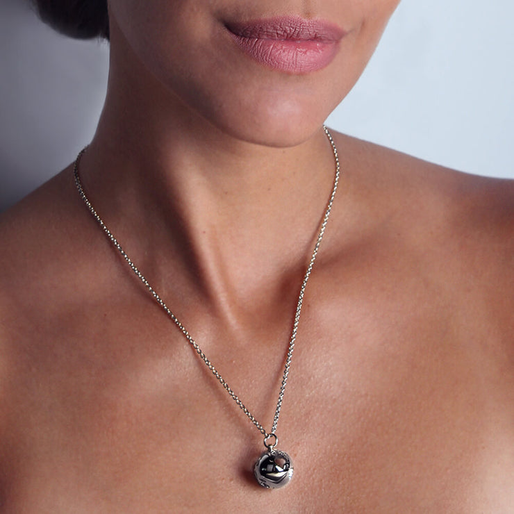 Wearing Rhodium Globe Necklace by Cristina Ramella