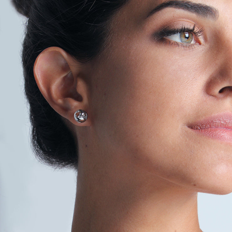 Wearing Small Earrings by Cristina Ramella